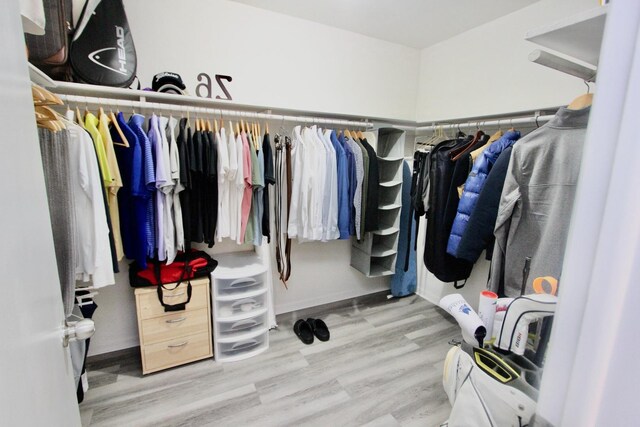 10 Old Oak Dr Unit 103, Buffalo Grove, IL 60089 - spacious closet featuring wood finished floors