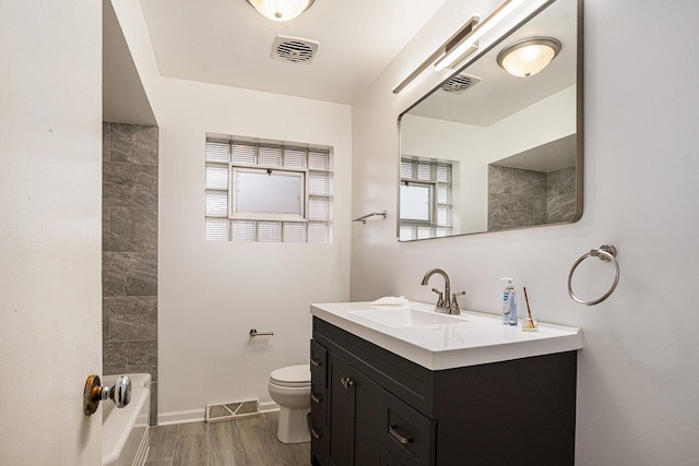 12101 S Lafayette Ave, Chicago, IL 60628 - bathroom featuring vanity, healthy amount of natural light, bathing tub / shower combination, and wood finished floors