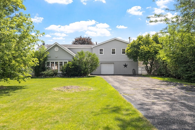 10409 S 83rd Ave, Palos Hills, IL 60465 - view of front facade with driveway, a garage, and a chimney