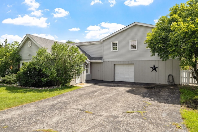 10409 S 83rd Ave, Palos Hills, IL 60465 - view of front of property featuring driveway, a shingled roof, and a garage