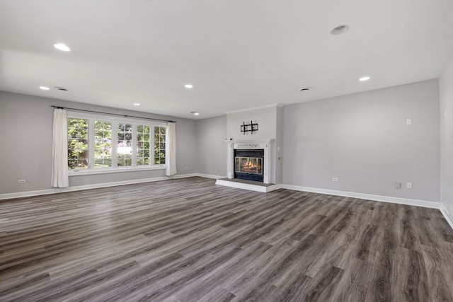 10409 S 83rd Ave, Palos Hills, IL 60465 - unfurnished living room with recessed lighting, dark wood-type flooring, and a glass covered fireplace