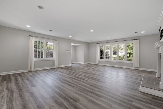 10409 S 83rd Ave, Palos Hills, IL 60465 - unfurnished living room with plenty of natural light, recessed lighting, a fireplace, and wood finished floors