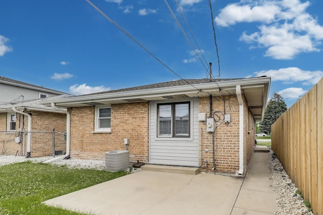 6105 W 83rd St, Burbank, IL 60459 - rear view of house with brick siding and a patio