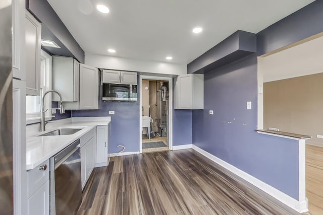 6105 W 83rd St, Burbank, IL 60459 - kitchen featuring stainless steel appliances, dark wood-type flooring, recessed lighting, and light countertops