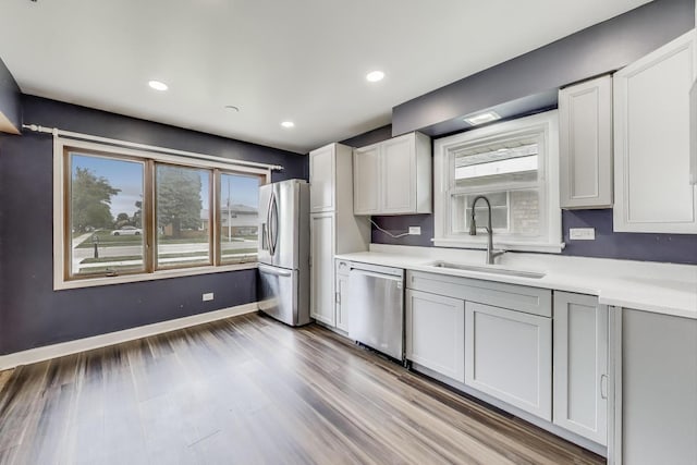 6105 W 83rd St, Burbank, IL 60459 - kitchen with appliances with stainless steel finishes, light countertops, wood finished floors, recessed lighting, and white cabinets