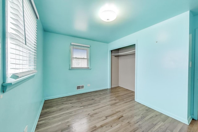 6105 W 83rd St, Burbank, IL 60459 - unfurnished bedroom featuring light wood-style flooring and a closet