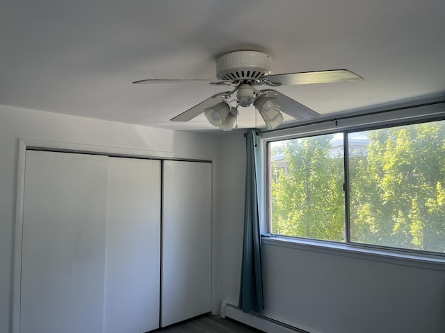 415 Wesley Ave Unit 21, Oak Park, IL 60302 - unfurnished bedroom with a closet, a ceiling fan, and a baseboard heating unit
