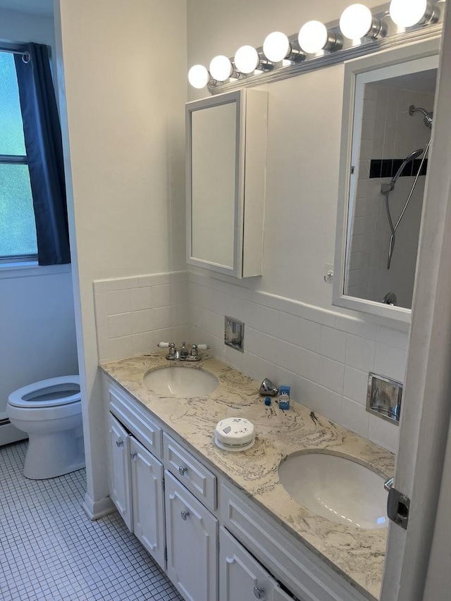 415 Wesley Ave Unit 21, Oak Park, IL 60302 - bathroom with double vanity, tasteful backsplash, and tile patterned floors