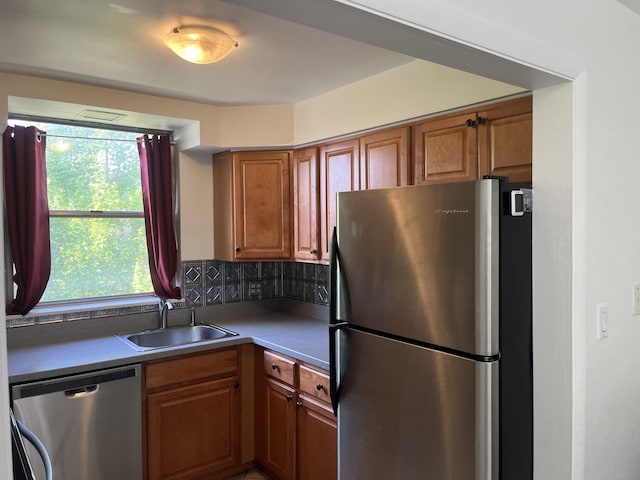 415 Wesley Ave Unit 21, Oak Park, IL 60302 - kitchen with stainless steel appliances, brown cabinets, and backsplash