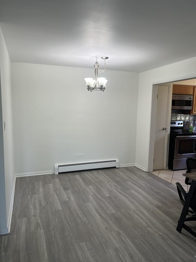 415 Wesley Ave Unit 21, Oak Park, IL 60302 - unfurnished dining area with baseboard heating, a chandelier, and light wood-style floors