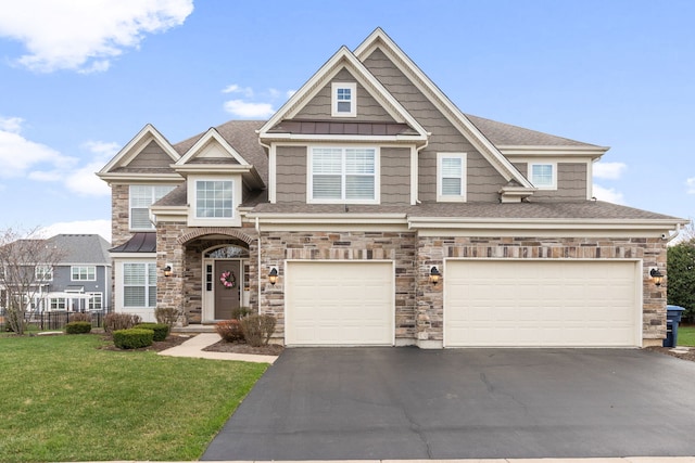 39W869 Kellar Sq, Geneva, IL 60134 - view of front facade with asphalt driveway, a front lawn, a garage, stone siding, and roof with shingles