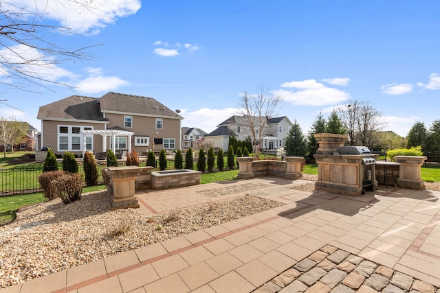 39W869 Kellar Sq, Geneva, IL 60134 - view of patio featuring an outdoor kitchen, a residential view, and a fire pit
