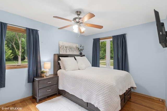 609 N Eastman Dr, Mount Prospect, IL 60056 - bedroom with wood finished floors and a ceiling fan
