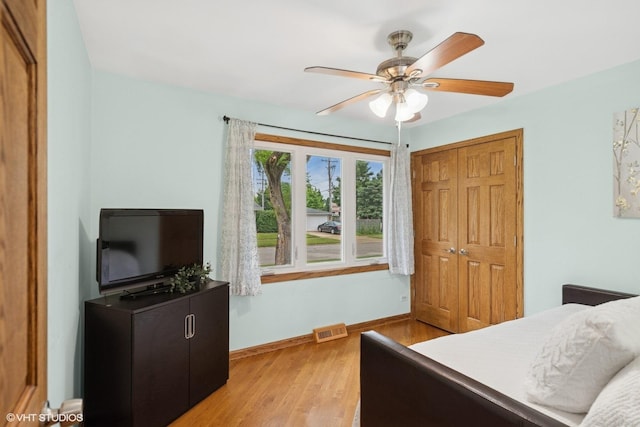 609 N Eastman Dr, Mount Prospect, IL 60056 - bedroom with a closet, light wood-type flooring, and a ceiling fan