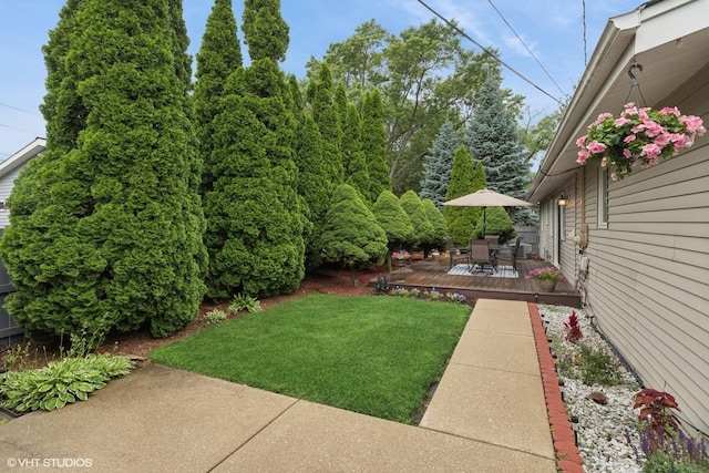 609 N Eastman Dr, Mount Prospect, IL 60056 - view of green lawn with a deck and outdoor dining area