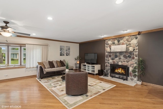 609 N Eastman Dr, Mount Prospect, IL 60056 - living area with crown molding, a fireplace, wood finished floors, ceiling fan, and recessed lighting