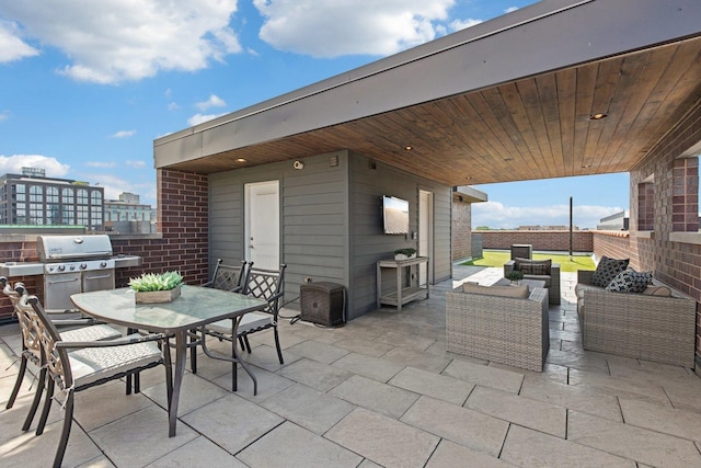 450 N Sangamon St Unit 4, Chicago, IL 60642 - view of patio featuring an outdoor living space, outdoor dining area, and grilling area