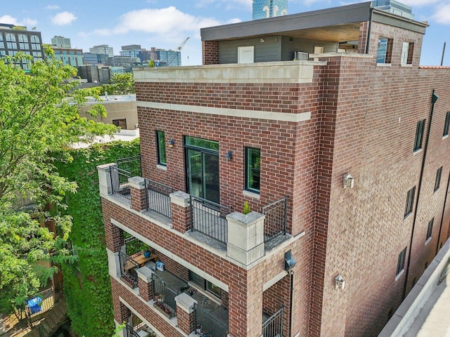 450 N Sangamon St Unit 4, Chicago, IL 60642 - back of property featuring a balcony and brick siding