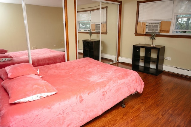 9275 W Noel Ave Unit 3C, Des Plaines, IL 60016 - bedroom featuring wood finished floors, cooling unit, and a baseboard radiator