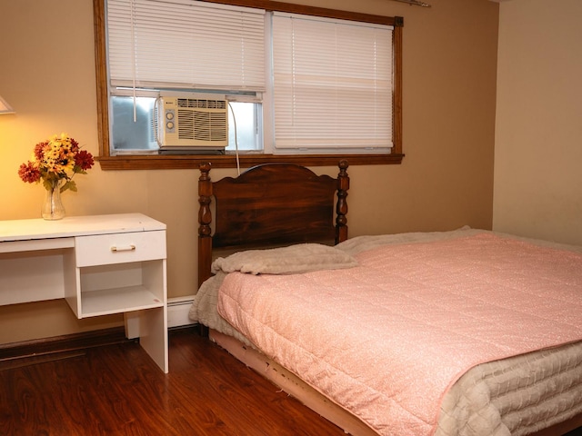 9275 W Noel Ave Unit 3C, Des Plaines, IL 60016 - bedroom with dark wood finished floors, a baseboard heating unit, and built in desk