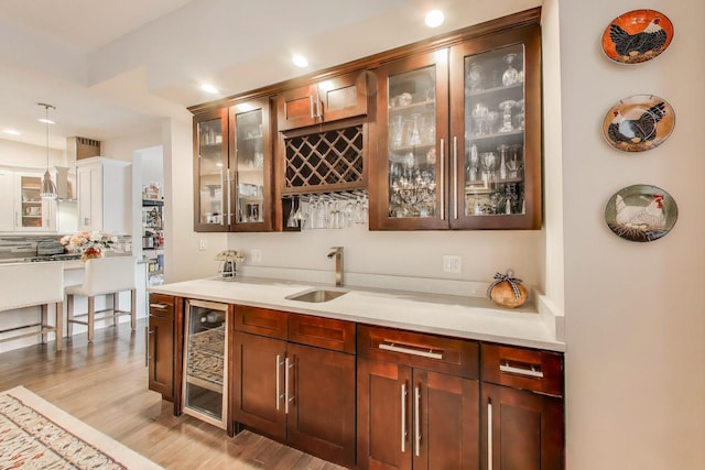3239 Wesley Ave, Berwyn, IL 60402 - indoor wet bar featuring wine cooler, recessed lighting, decorative light fixtures, light wood-type flooring, and decorative backsplash
