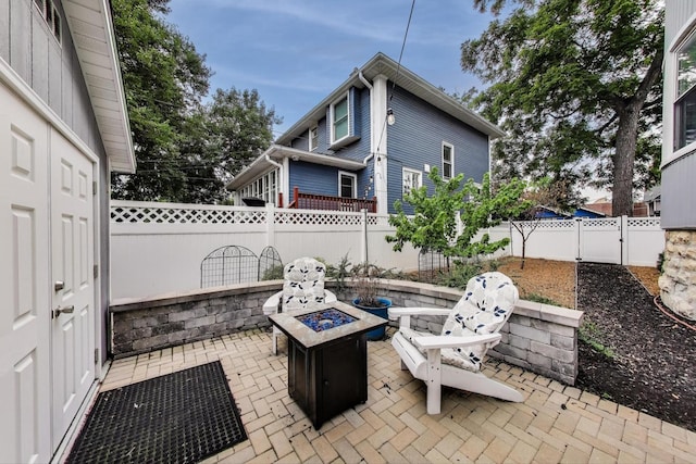 3239 Wesley Ave, Berwyn, IL 60402 - fenced backyard with an outdoor fire pit and a patio area