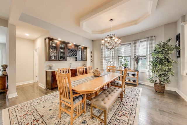 3239 Wesley Ave, Berwyn, IL 60402 - dining room featuring light wood finished floors, a tray ceiling, a chandelier, and recessed lighting
