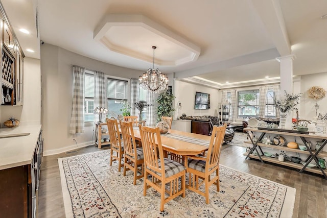 3239 Wesley Ave, Berwyn, IL 60402 - dining area with a raised ceiling, wood finished floors, recessed lighting, a chandelier, and ornate columns