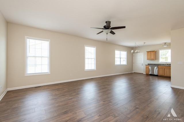 965 W Bergera Rd, Braidwood, IL 60408 - unfurnished living room featuring ceiling fan, a chandelier, plenty of natural light, and dark wood-style flooring