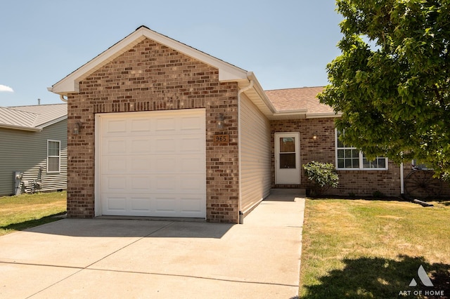965 W Bergera Rd, Braidwood, IL 60408 - ranch-style house with concrete driveway, brick siding, a front yard, and an attached garage