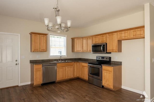 965 W Bergera Rd, Braidwood, IL 60408 - kitchen featuring stainless steel appliances, dark countertops, dark wood finished floors, and a chandelier