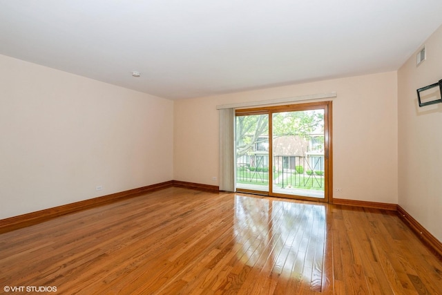 12720 Carriage Ln Unit H2, Crestwood, IL 60418 - spare room with light wood finished floors and baseboards