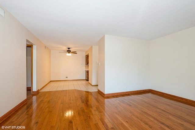 12720 Carriage Ln Unit H2, Crestwood, IL 60418 - unfurnished room with light wood finished floors and a ceiling fan