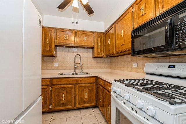 12720 Carriage Ln Unit H2, Crestwood, IL 60418 - kitchen with white appliances, light countertops, brown cabinets, and light tile patterned flooring