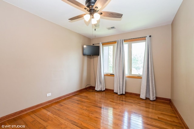 12720 Carriage Ln Unit H2, Crestwood, IL 60418 - spare room with light wood finished floors and a ceiling fan