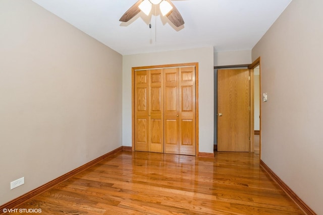 12720 Carriage Ln Unit H2, Crestwood, IL 60418 - unfurnished bedroom with light wood-style flooring, a closet, and a ceiling fan