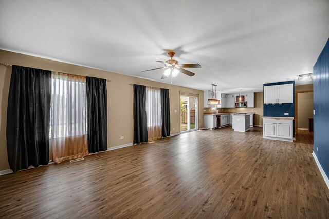 352 Westport Dr, Pingree Grove, IL 60140 - unfurnished living room with ceiling fan and dark wood finished floors