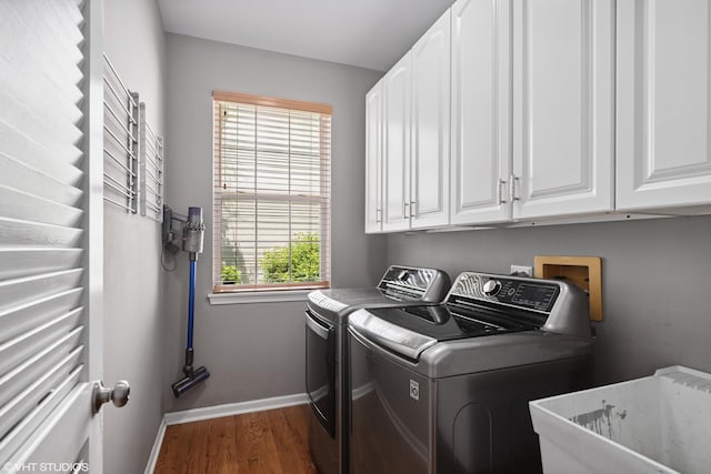 6162 Crossland Blvd, Gurnee, IL 60031 - laundry room with cabinet space, washing machine and clothes dryer, and dark wood-type flooring