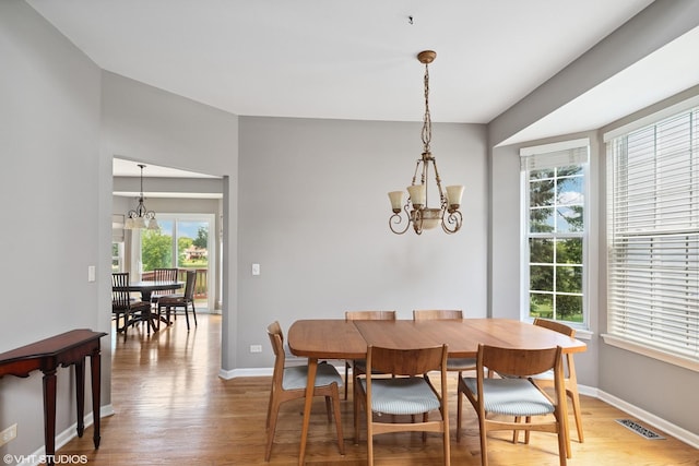6162 Crossland Blvd, Gurnee, IL 60031 - dining area with a chandelier and light wood-style flooring