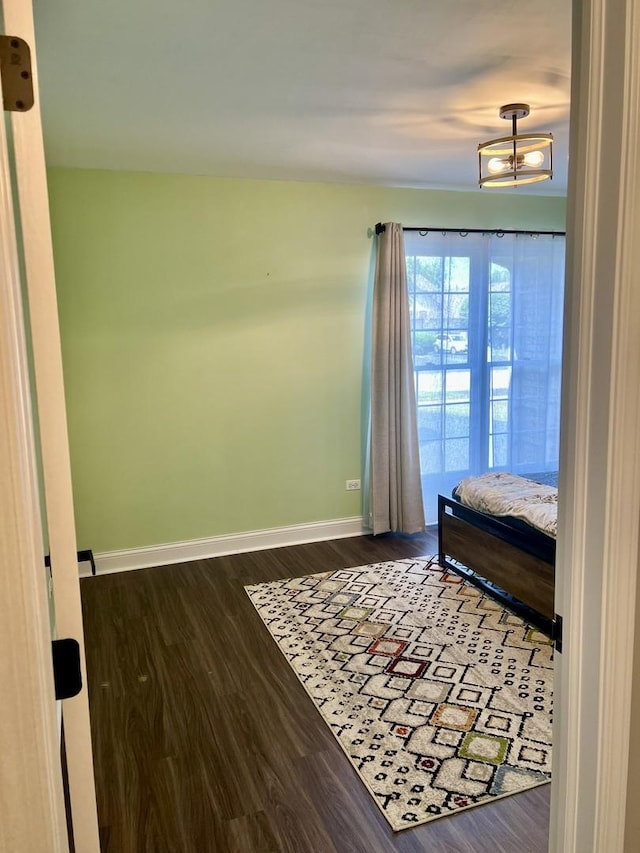 7727 Bristol Park Dr Unit 7727, Tinley Park, IL 60477 - bedroom with baseboards and dark wood-style floors