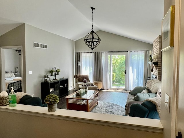7727 Bristol Park Dr Unit 7727, Tinley Park, IL 60477 - living area featuring wood finished floors, vaulted ceiling, and a chandelier