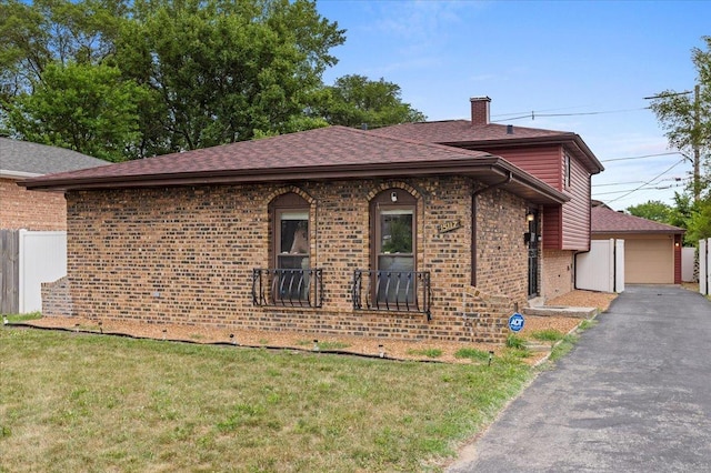 15117 Madison Ave, Dolton, IL 60419 - view of property exterior featuring brick siding, a chimney, roof with shingles, and a garage