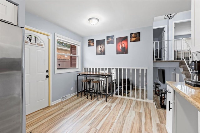 15117 Madison Ave, Dolton, IL 60419 - dining area with light wood-type flooring and baseboards