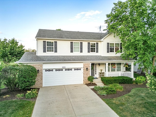 9890 Riverside Dr, Huntley, IL 60142 - traditional-style house featuring brick siding, a porch, concrete driveway, a garage, and a shingled roof