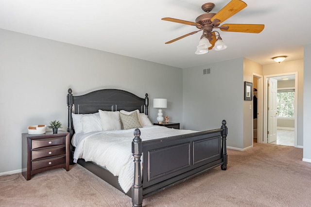 9890 Riverside Dr, Huntley, IL 60142 - bedroom with light carpet, ceiling fan, and connected bathroom