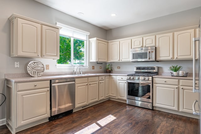 9890 Riverside Dr, Huntley, IL 60142 - kitchen featuring appliances with stainless steel finishes, light countertops, dark wood-style flooring, and recessed lighting