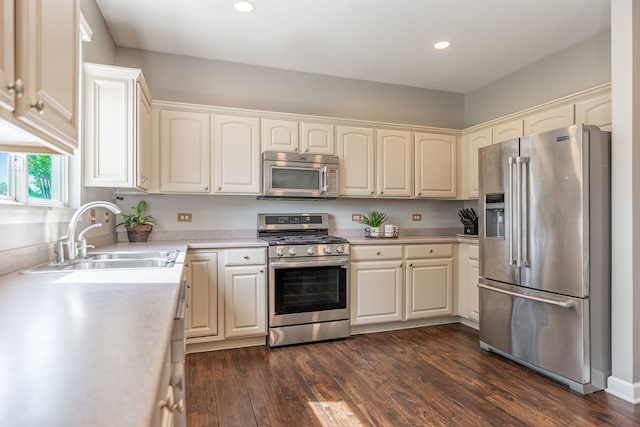 9890 Riverside Dr, Huntley, IL 60142 - kitchen with appliances with stainless steel finishes, light countertops, dark wood finished floors, and recessed lighting