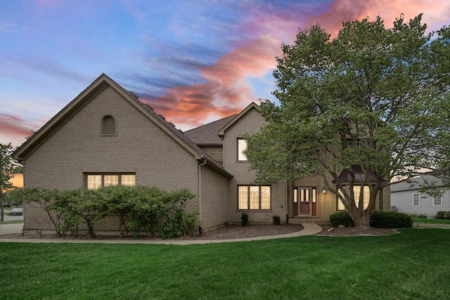 541 Clover Dr, Algonquin, IL 60102 - traditional-style house featuring a front lawn and brick siding