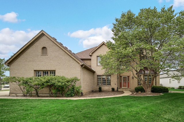 541 Clover Dr, Algonquin, IL 60102 - traditional-style home featuring brick siding and a front lawn