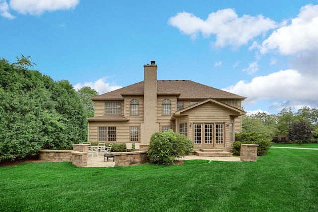 541 Clover Dr, Algonquin, IL 60102 - rear view of property featuring a lawn, a patio, french doors, a chimney, and roof with shingles